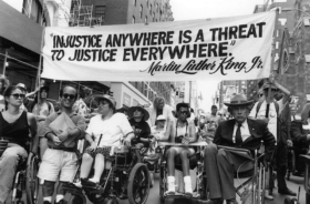 Disability rights activists march down Madison Avenue in New York City.